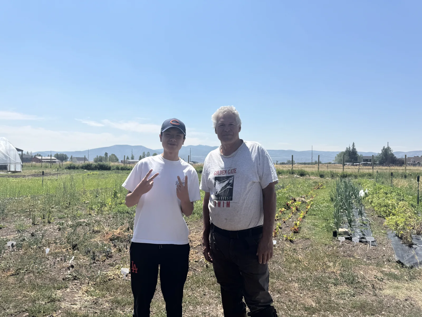 Jack Huang with Stephen in a vegetable field at Splendor Valley Farms.